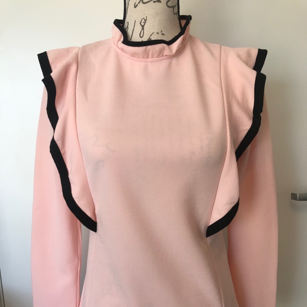 Pink long sleeve top with side lapels